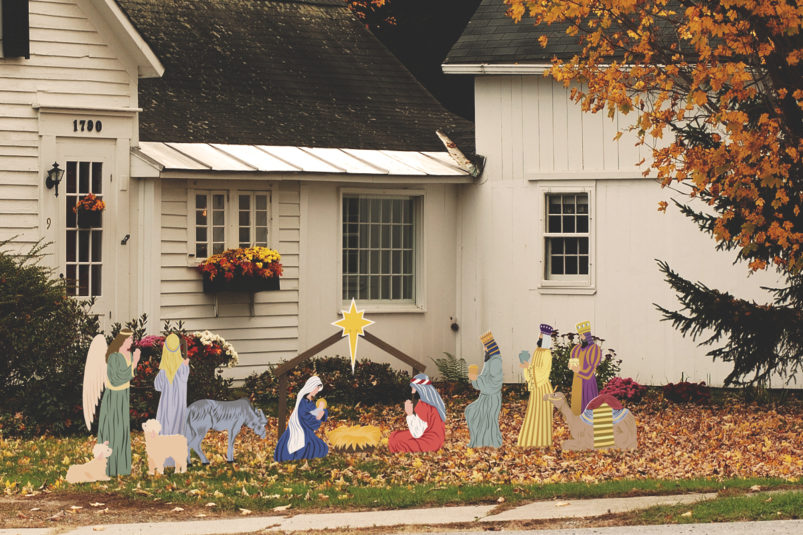 Full outdoor manger scene outside of old house