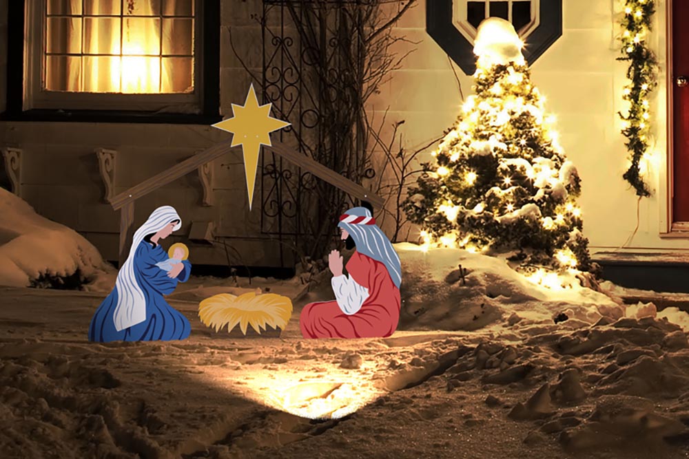 outdoor nativity scene with light in snow